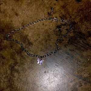 A butterfly chain necklace .
